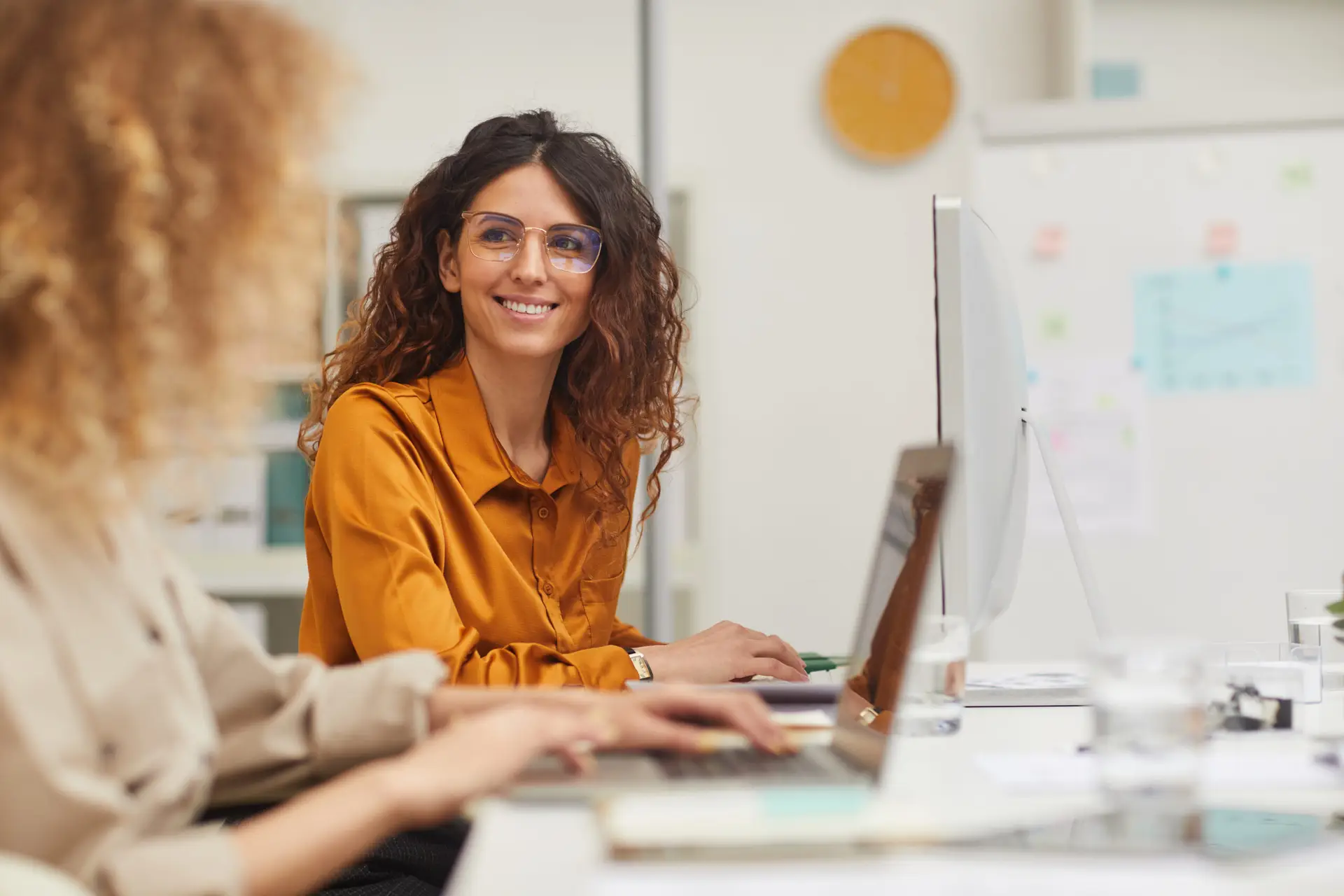 Two Charming Women Interacting While Working