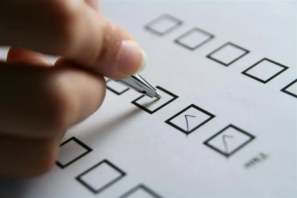 image of a person checking of boxes