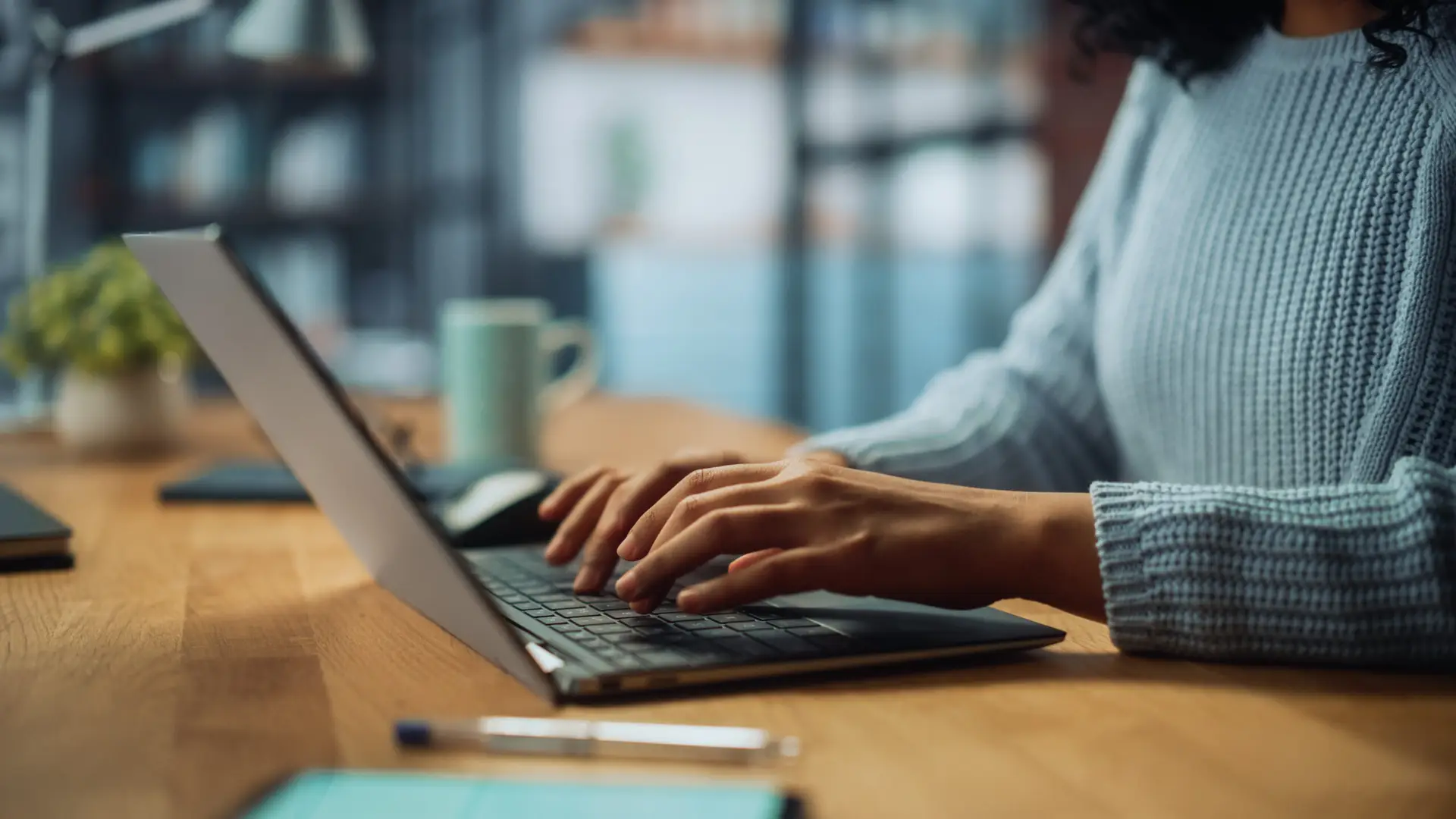 Close Up on Hands of a Female Specialist Working on Laptop Computer