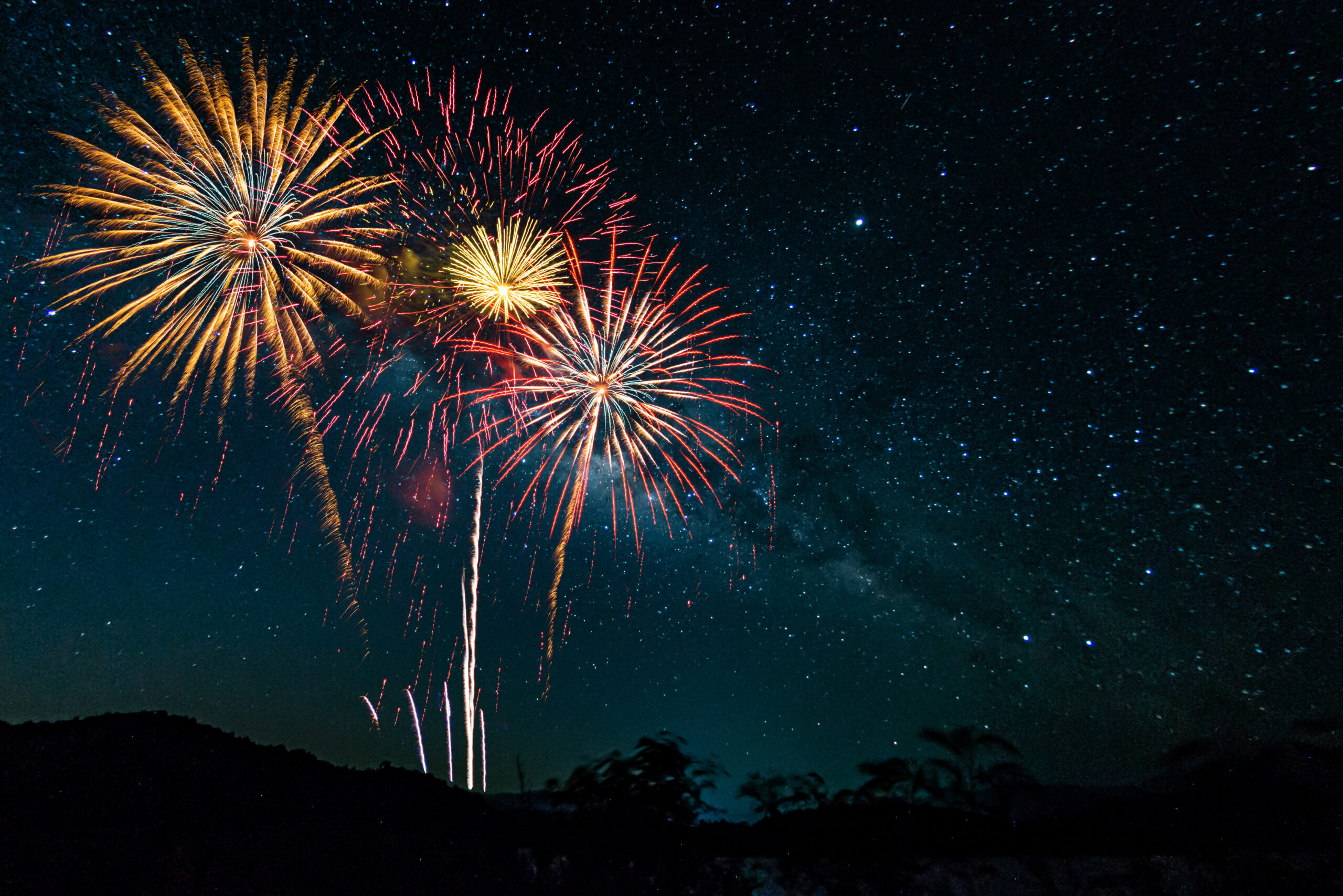 Colorful of fireworks display on milky way in night sky background