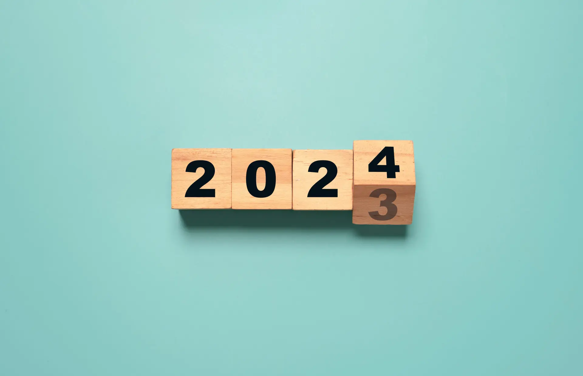 Flipping of 2023 to 2024 on wooden block cube for preparation new year change and start new business target strategy concept.