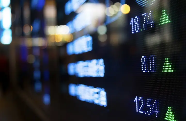 Image of rising stocks on a neon board