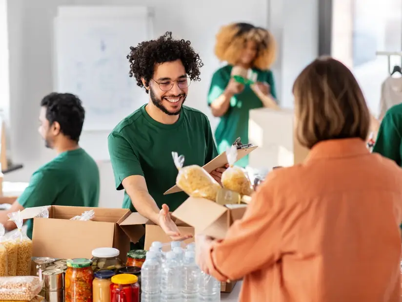 a group of volunteers collecting food donations