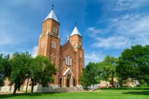 image of a church and lawn on a sunny day